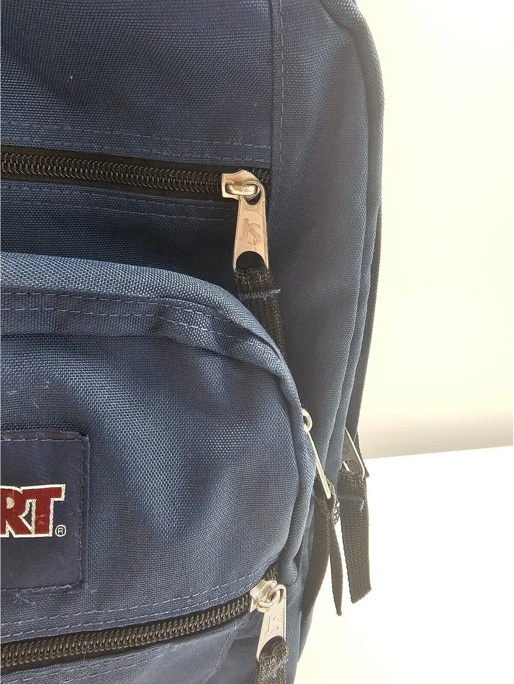 JanSport Classic Navy Blue Backpack with Multiple Compartments